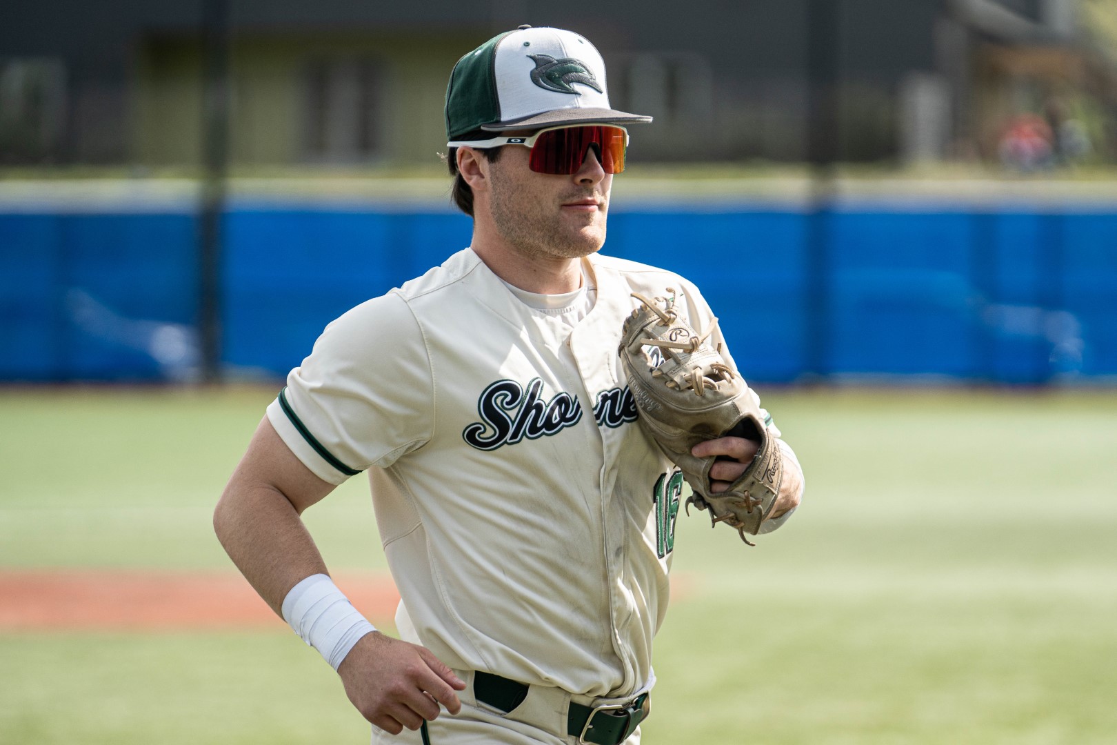 Shoreline infielder jogging across the field