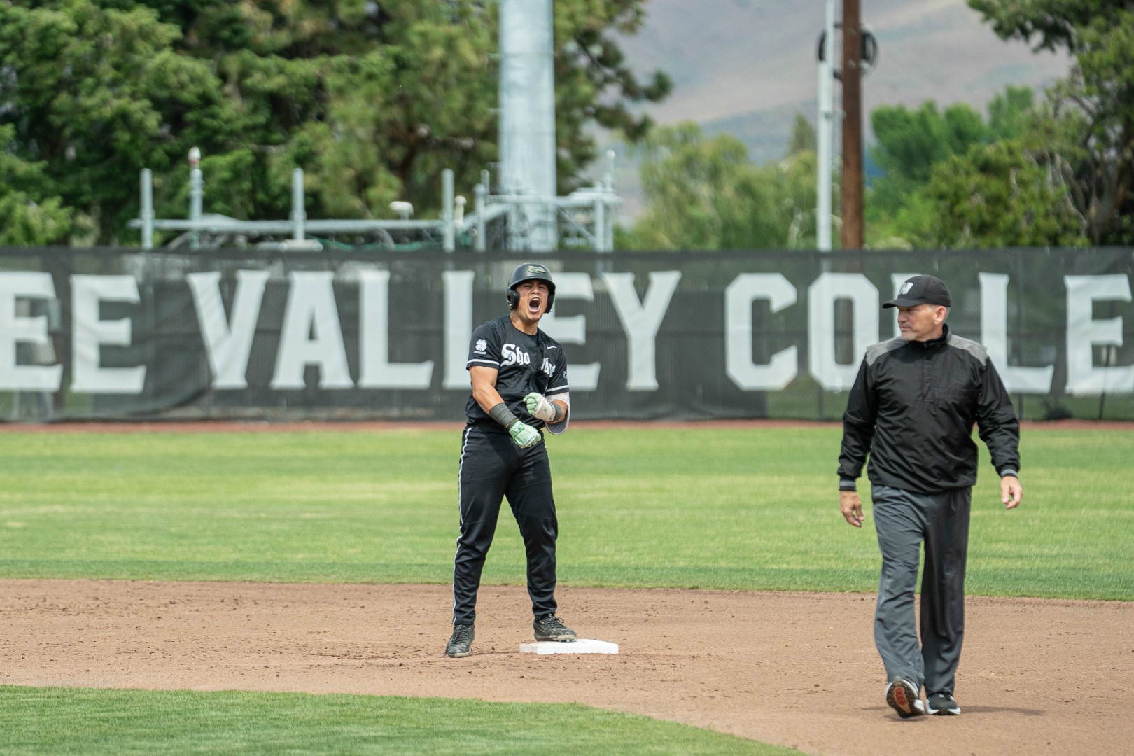 Shoreline player celebrating on the basepath during playoffs