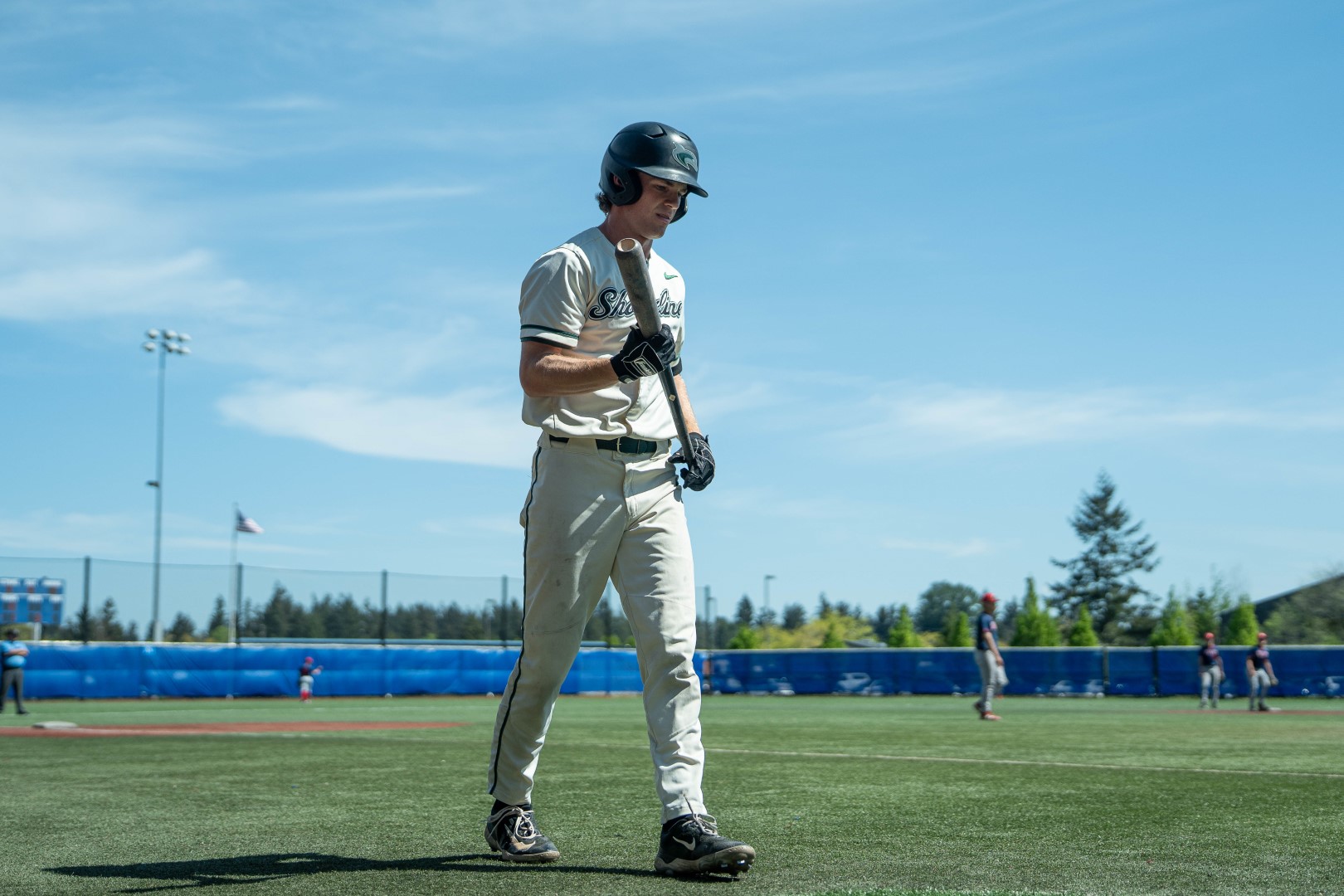 Shoreline batter walking to the plate carrying his bat