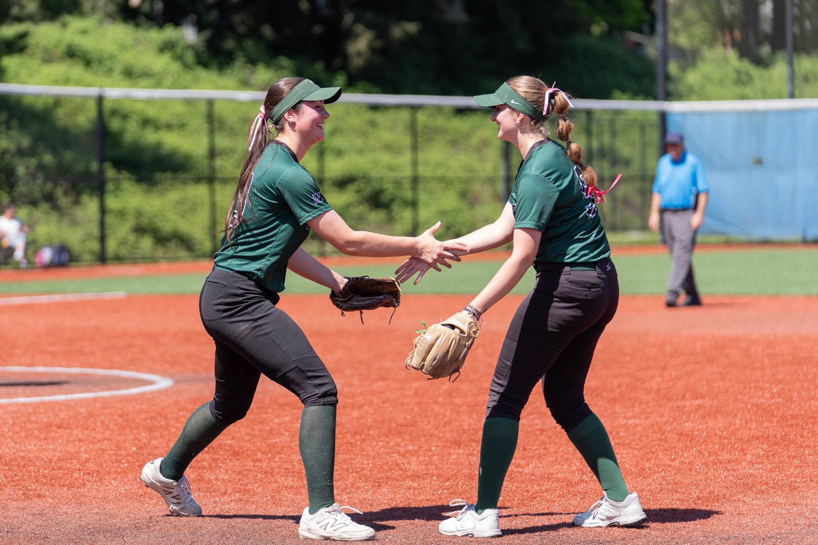 Shoreline softball teammates celebrating together during a game